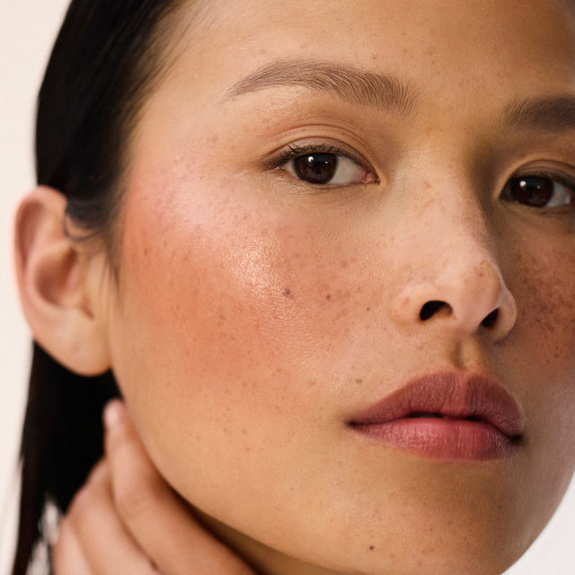 Medium skin tone model wearing Impressionist Multistick in Muse